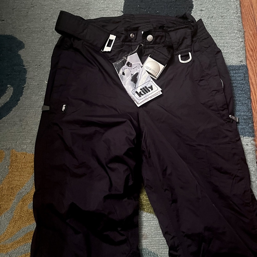 Men's ski pants. Black with button zipper. Brand new, tags still attached.